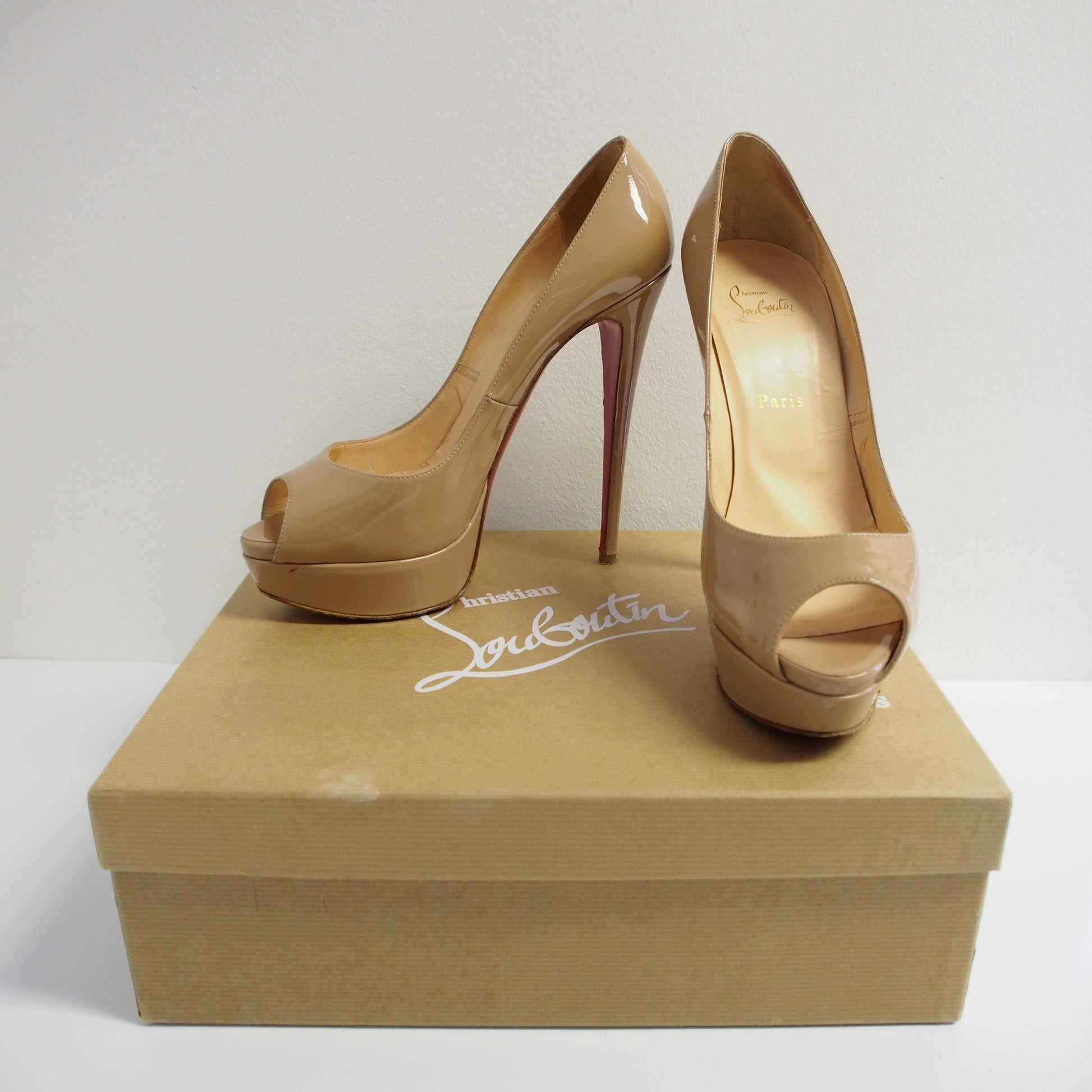 Nude patent platform outlet heels